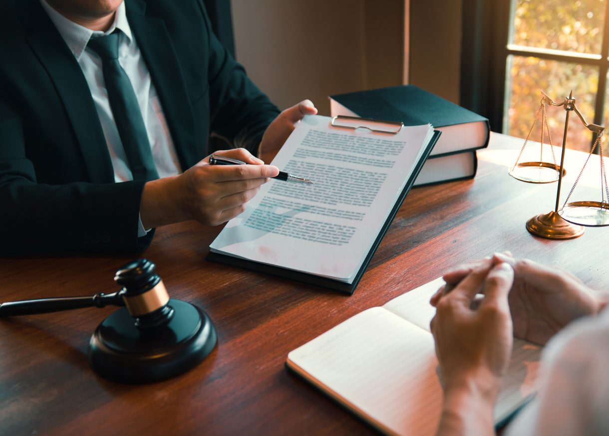 Discussing legal documents at a desk